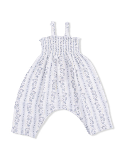 White and blue floral print jumpsuit with thin straps and a relaxed fit. Ideal for casual wear.
