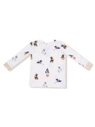 White long-sleeve shirt with playful dog prints engaging in various sports.