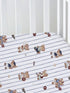 Crib sheet featuring playful teddy bears in sports attire on a blue striped background.