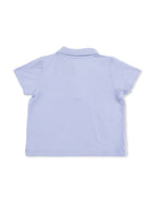 Back view of a light blue short-sleeve polo shirt on a white background.