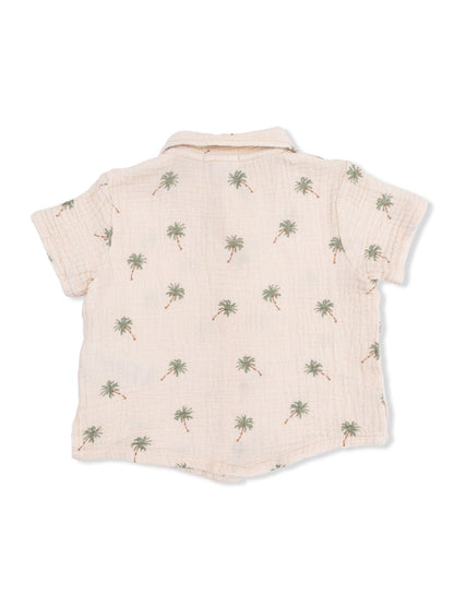 Light beige short-sleeve shirt with palm tree print, view of the back. Perfect for casual summer wear.
