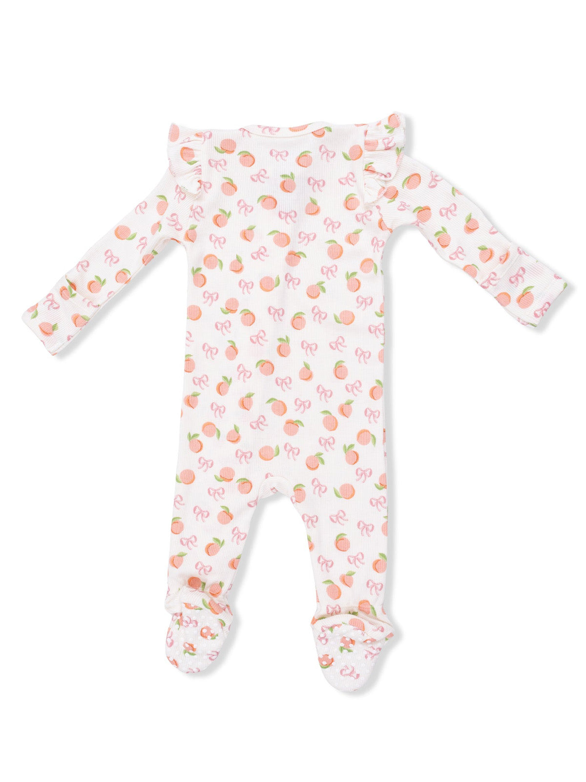 Infant onesie with a fruity peach and bow pattern, featuring long sleeves and footed legs.