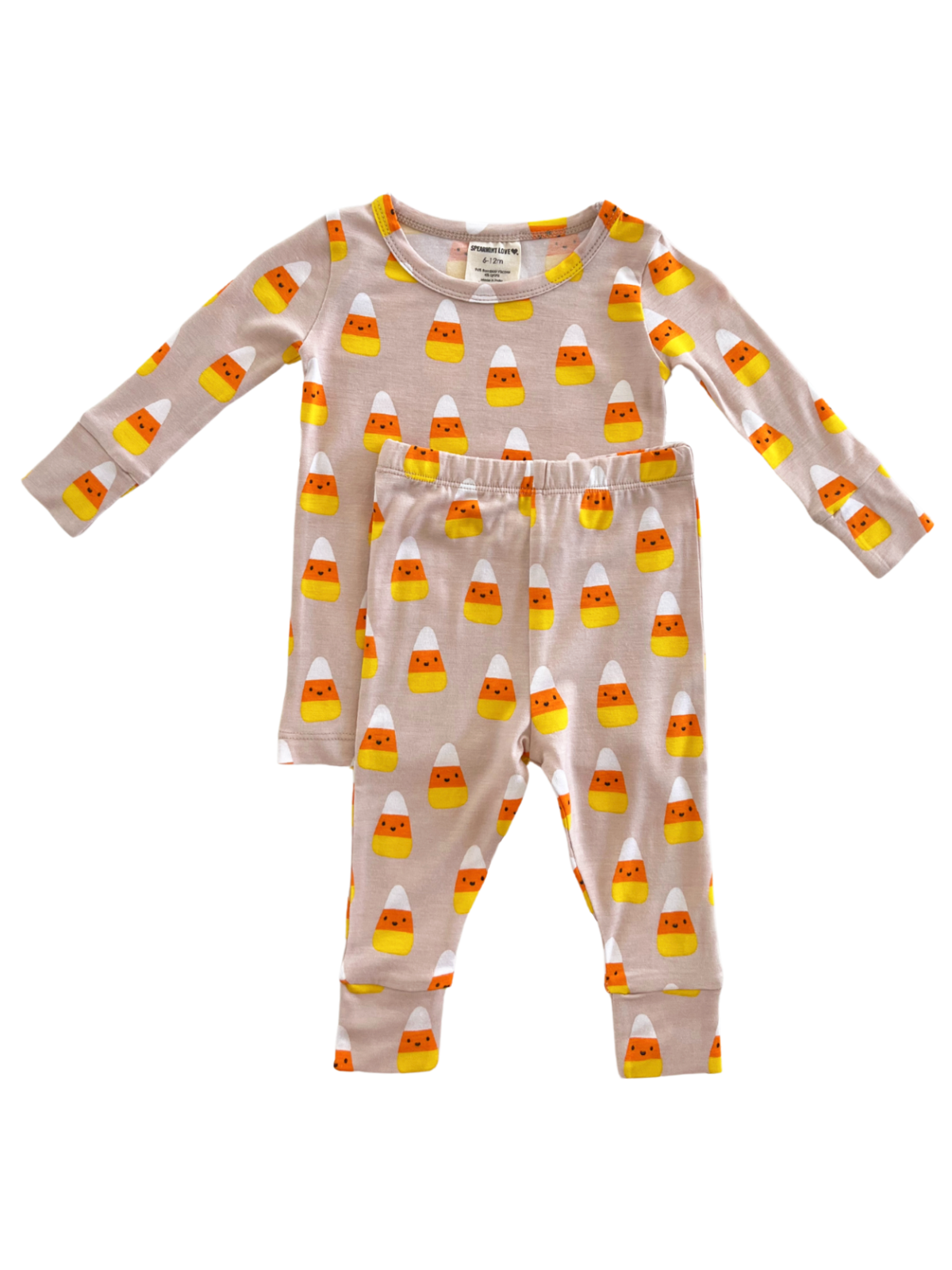 Candy corn patterned children's pajamas in soft fabric, featuring a long-sleeve top and matching pants.