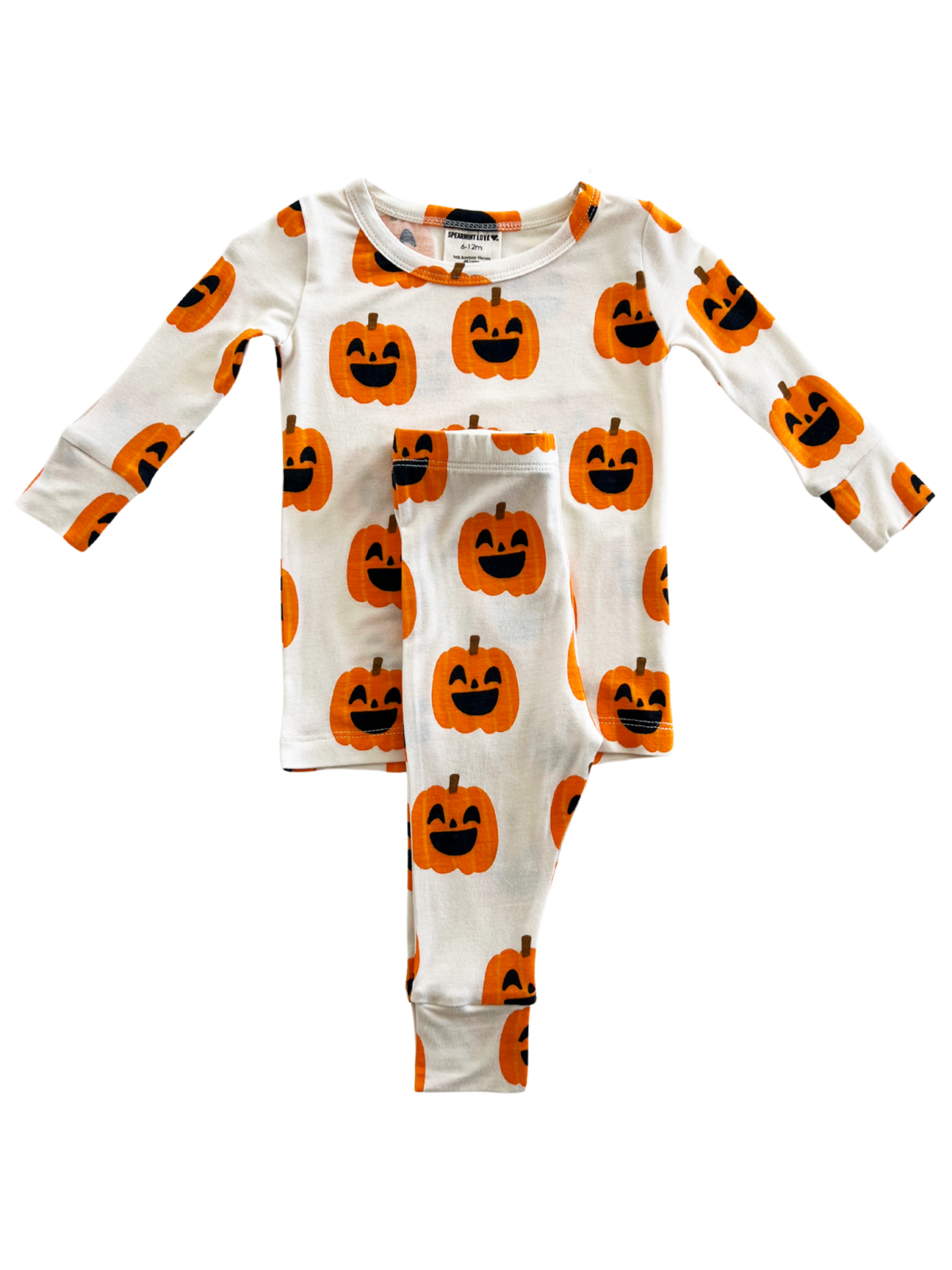 Toddler Halloween pajamas feature a fun pumpkin print on a white background. Perfect for festive nights.
