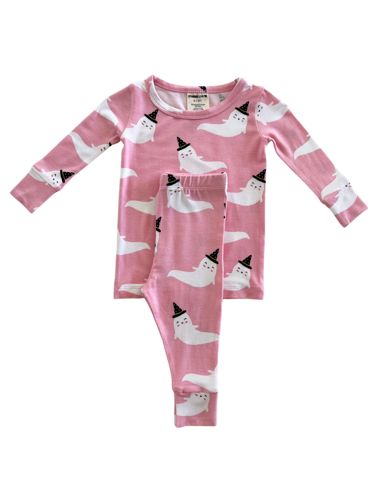 Pink pajamas with playful ghost patterns and party hats, featuring long sleeves and matching pants.