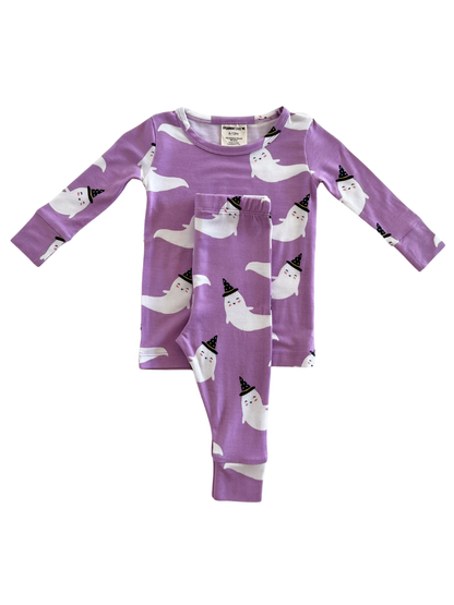 Purple ghost-themed pajama set featuring long sleeves and pants with playful smiling ghosts in party hats.