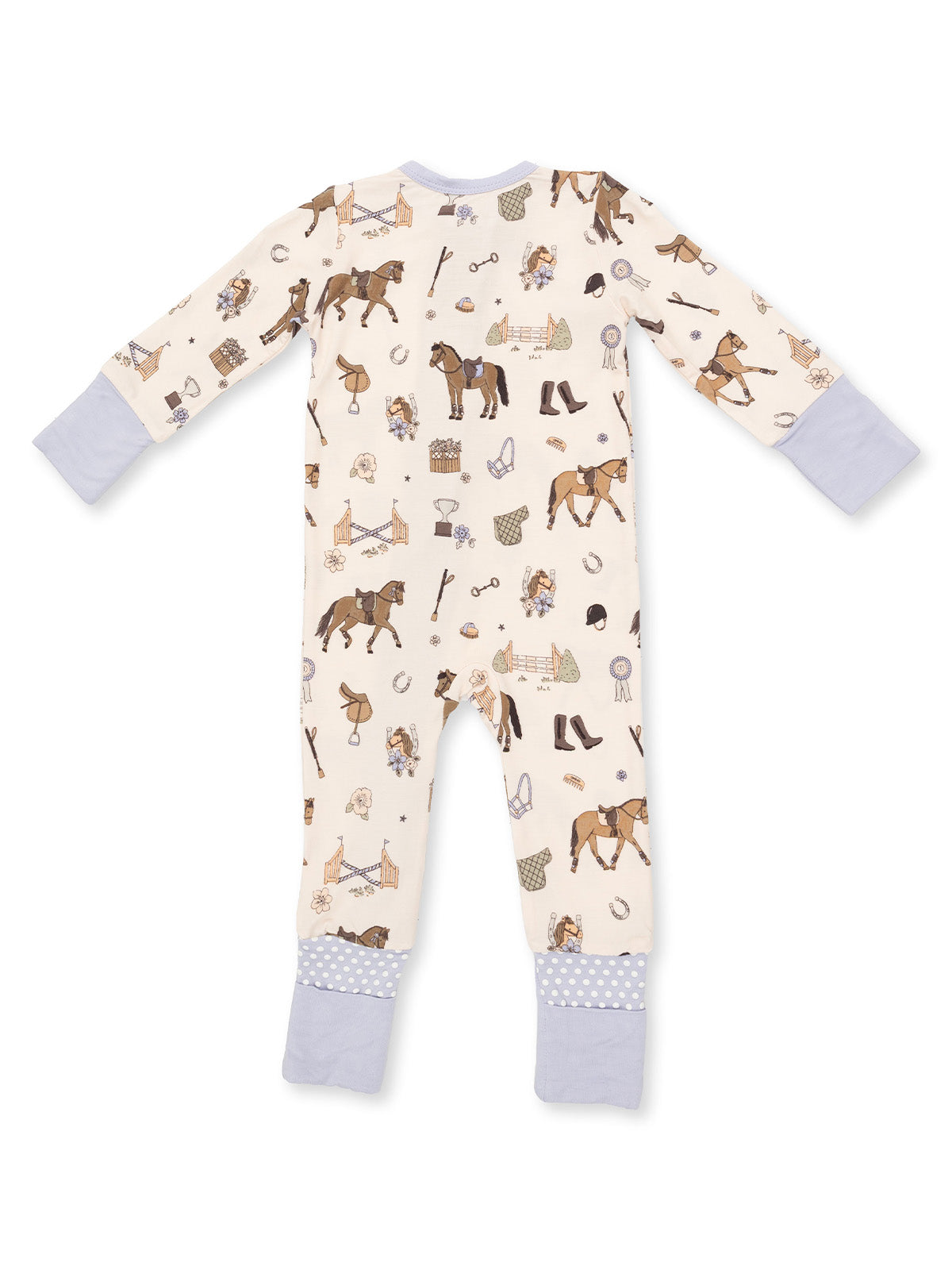Child's long-sleeve pajamas with horse and riding-themed patterns on a cream background.