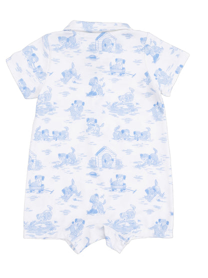 Light blue baby romper featuring playful puppies in various outdoor scenes on a white background.