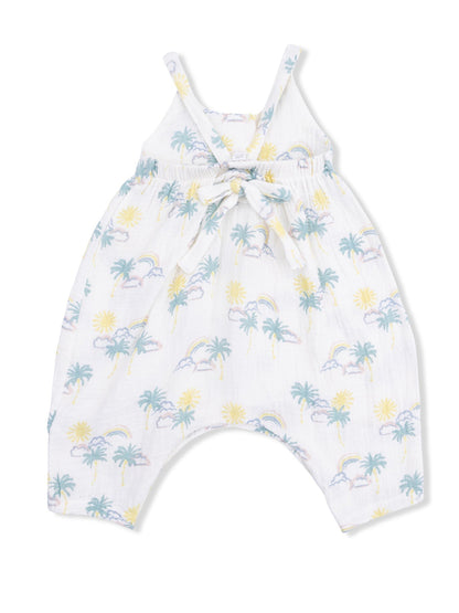 White sleeveless romper with pastel sun, rainbow, and palm tree print, featuring a tied waist detail.
