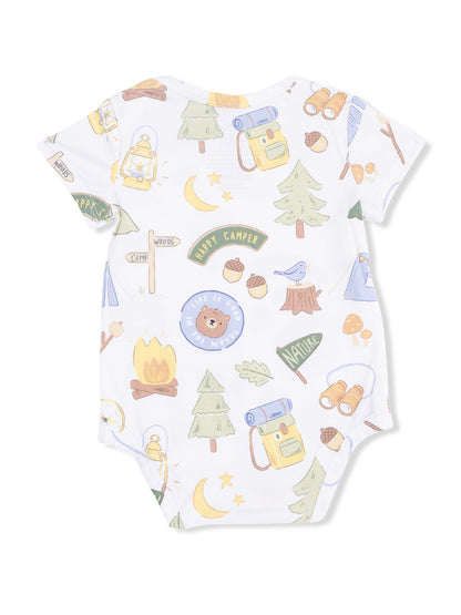 Baby onesie featuring playful camping-themed patterns, including trees, lanterns, and a bear.