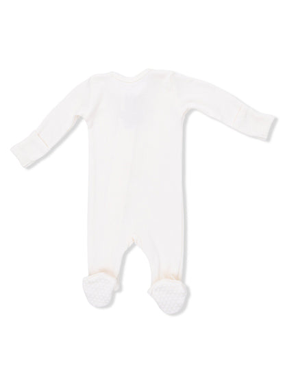 White baby footed onesie with long sleeves and textured soles, viewed from the back.