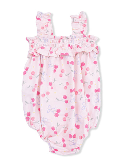 Pink baby romper with cherry and floral print, ruffled neckline, and shoulder straps.