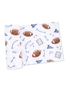 Football-themed blanket with scattered designs of footballs, play diagrams, and "Go Team" graphics.