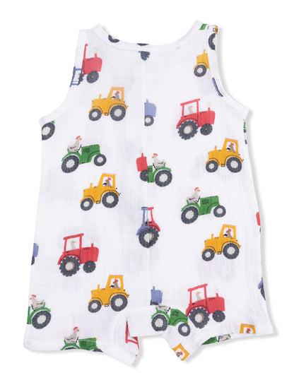 White sleeveless romper with colorful tractor print and animal designs, perfect for young children.
