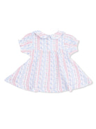 White dress with pink and blue floral patterns and a collar, featuring a flared skirt.