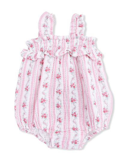 Pink floral baby romper with ruffled neckline and straps, featuring a striped pattern and snap closures at the bottom.