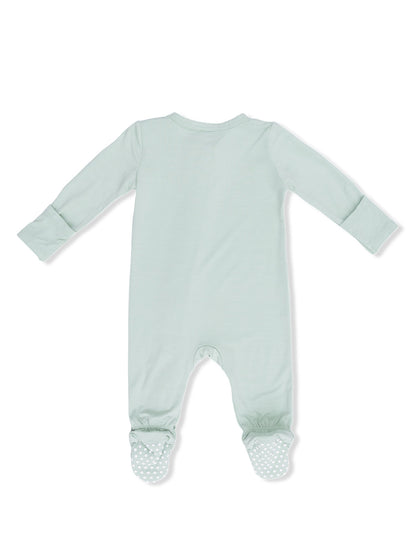 Light green baby onesie with long sleeves and dotted foot grips, shown from the back.