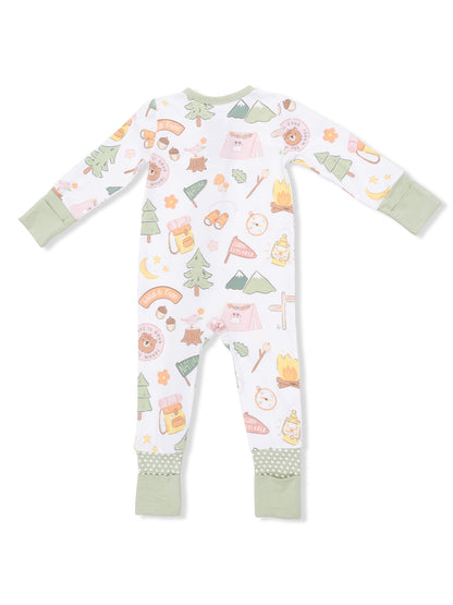 Kid's pajamas with a whimsical camping theme featuring animals, nature, and adventure icons in pastel colors.