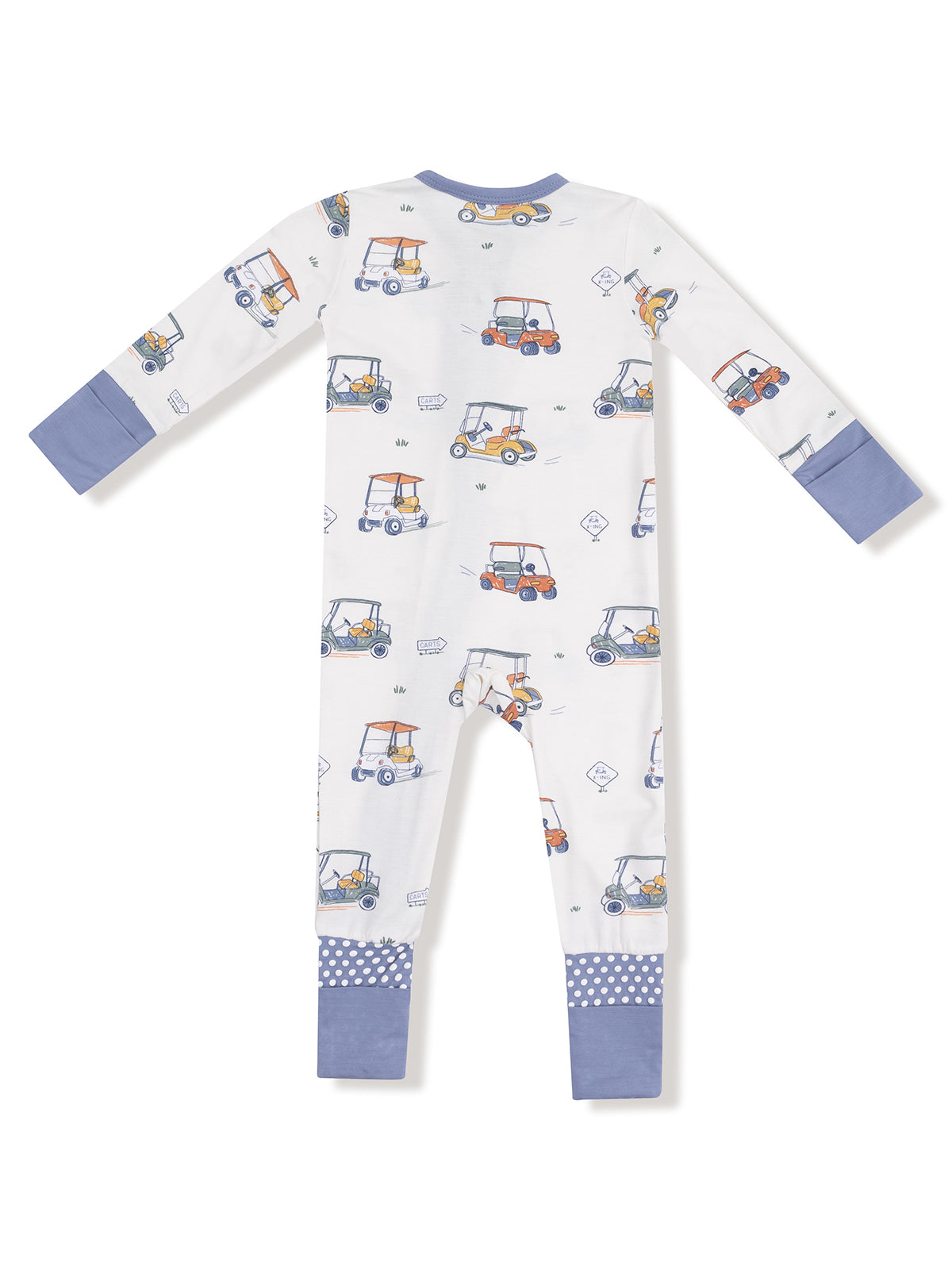 White pajamas featuring colorful golf carts, with blue cuffs and polka dot detailing at the ankles.
