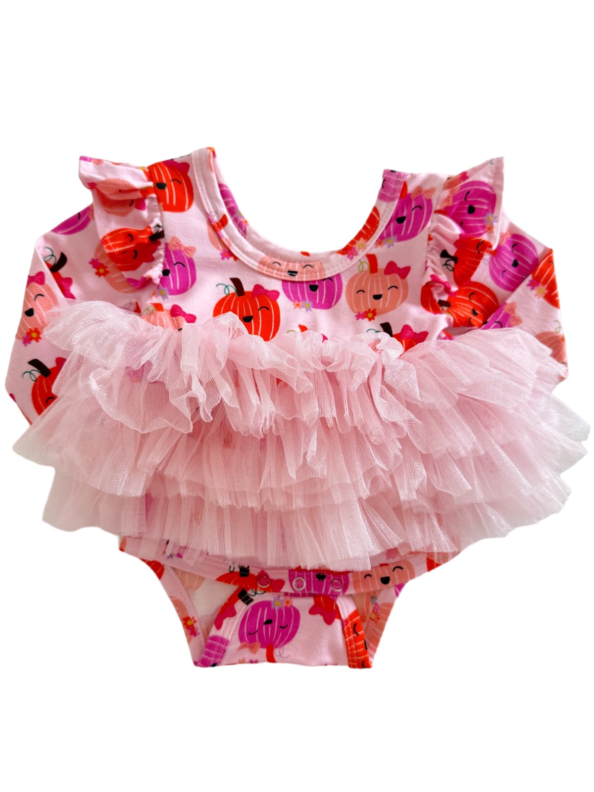 Pink baby swimsuit with pumpkin prints and a fluffy tulle ruffle at the waist.