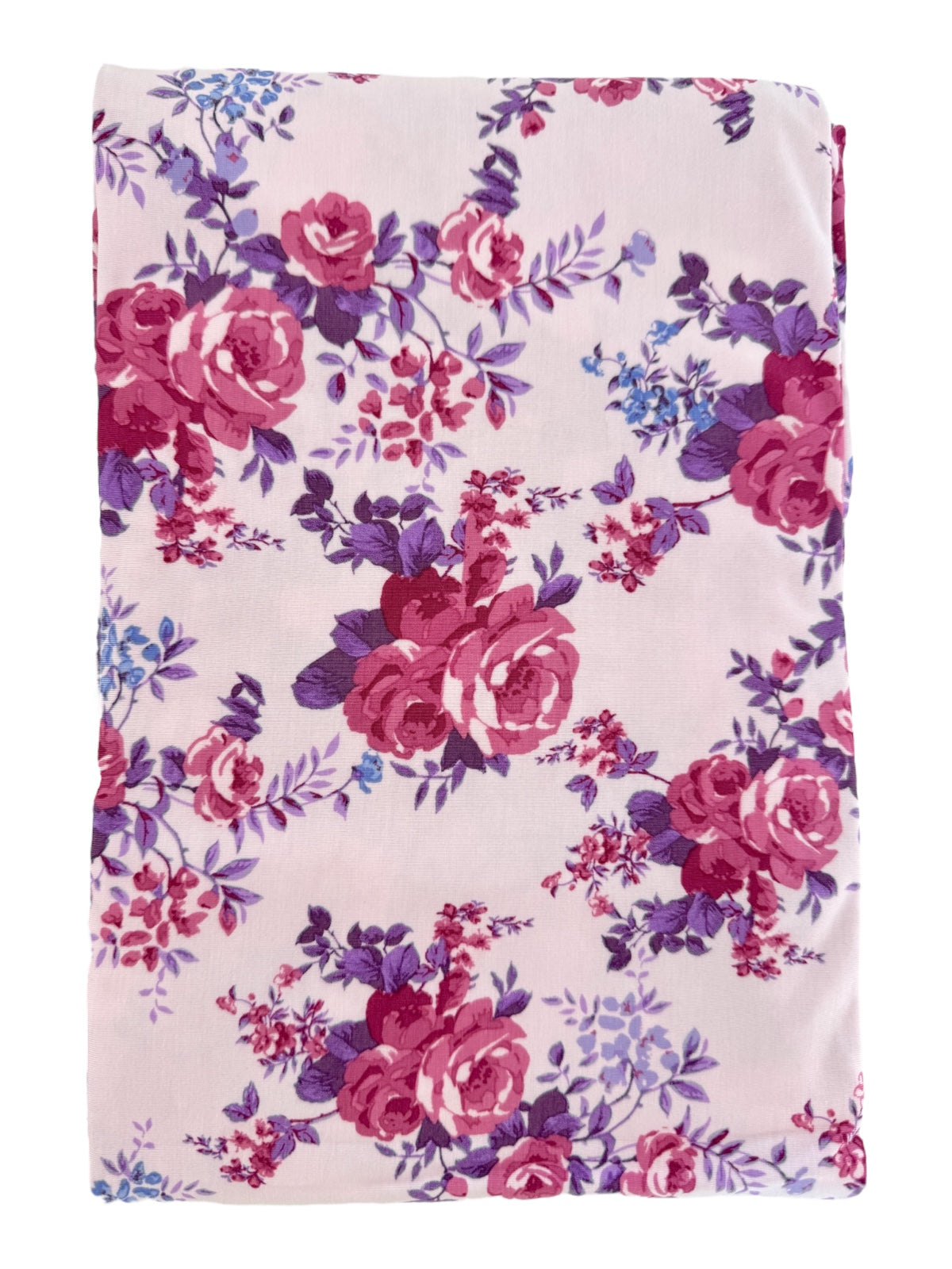 Floral fabric featuring pink and purple roses on a light background, ideal for crafting or sewing projects.
