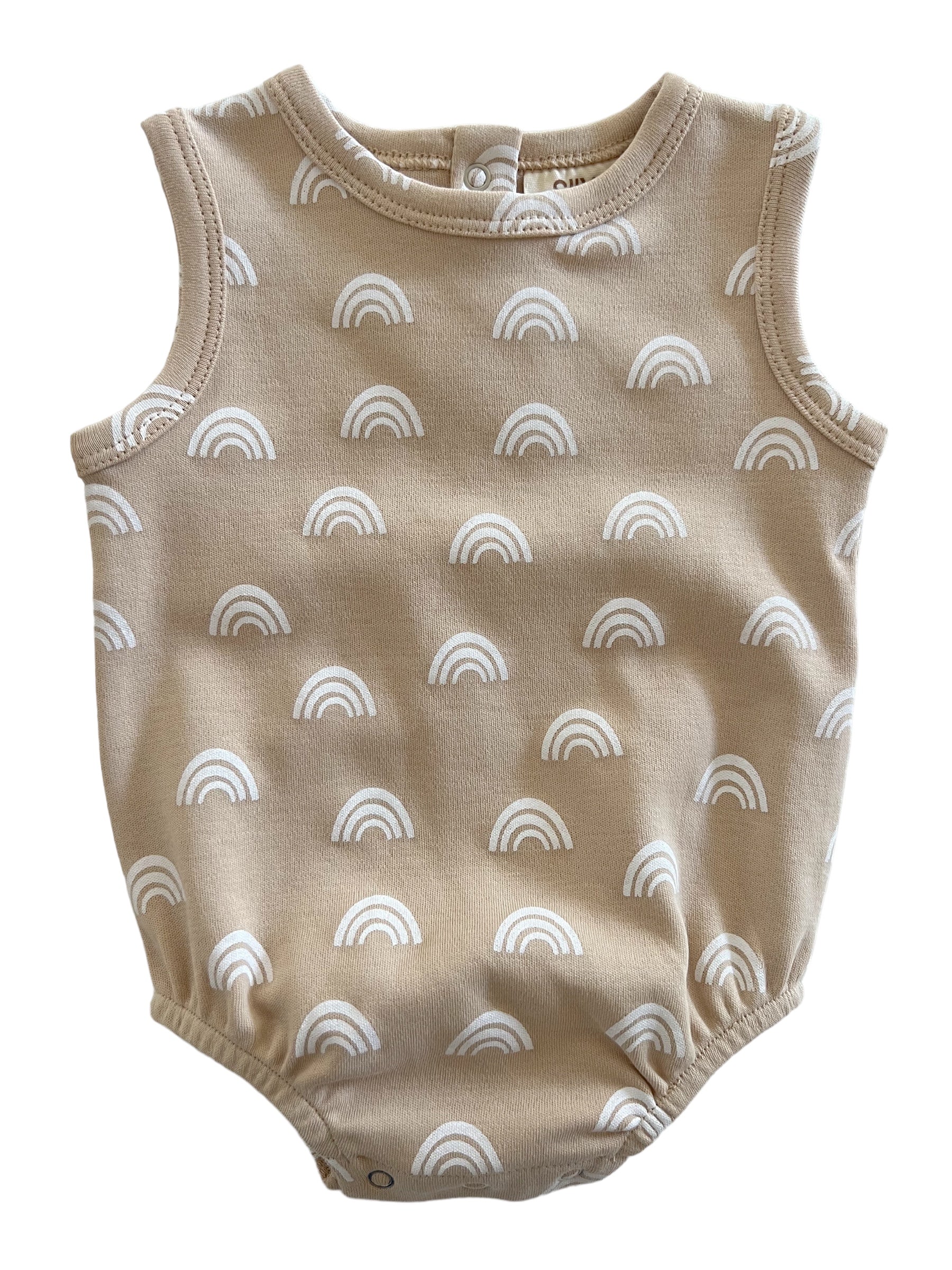 Tan baby onesie with white rainbow patterns, featuring a sleeveless design and snap closures.