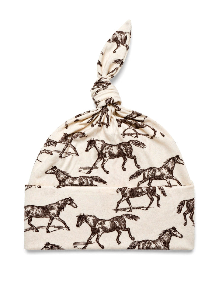 Cotton baby hat with a knot, featuring a brown horse print on a cream background.