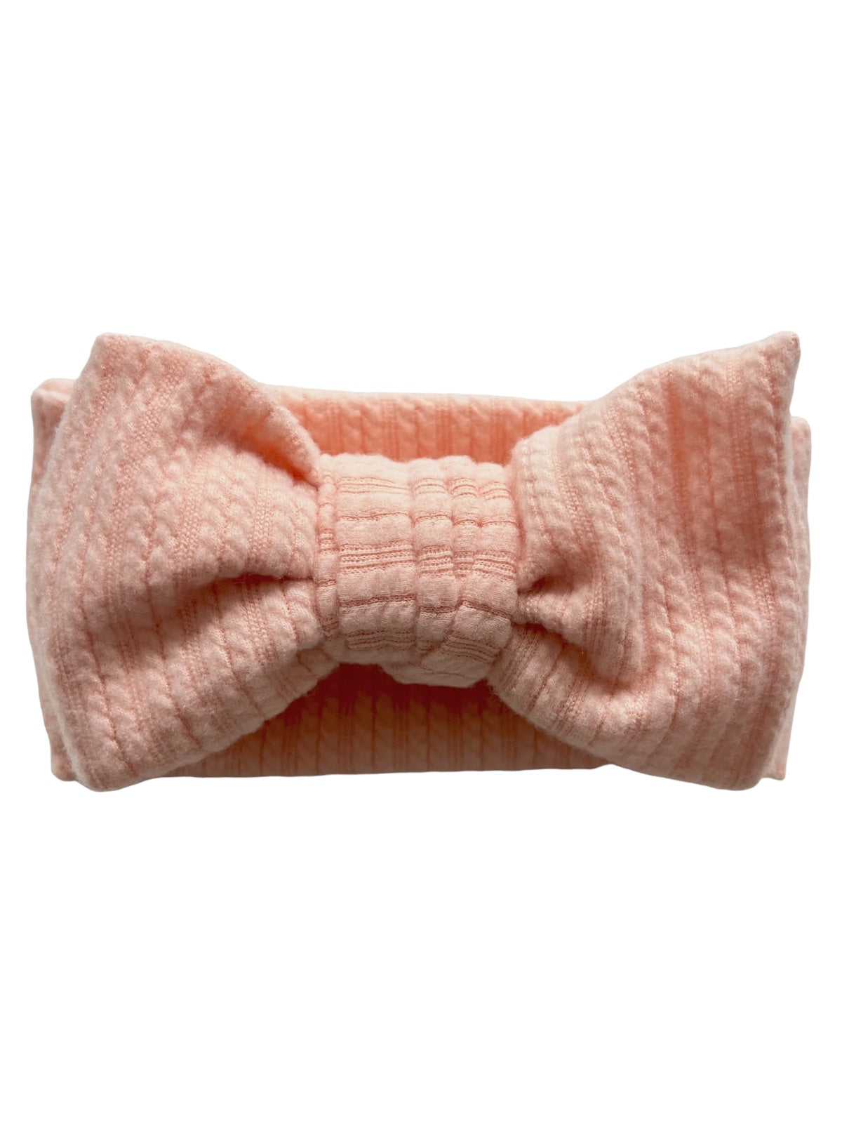 Pink textured headband with a large bow, designed for style and comfort.