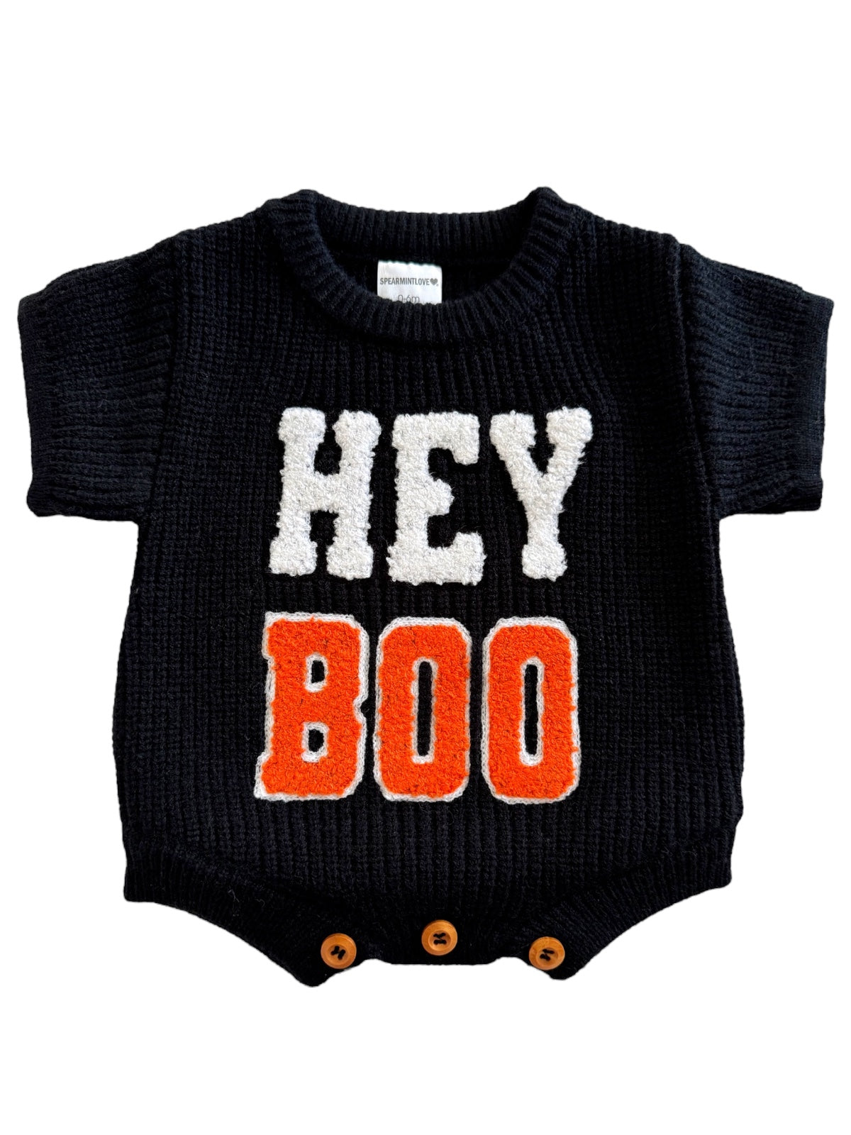Black baby onesie with "HEY BOO" text in white and orange, featuring short sleeves and bottom snap buttons.