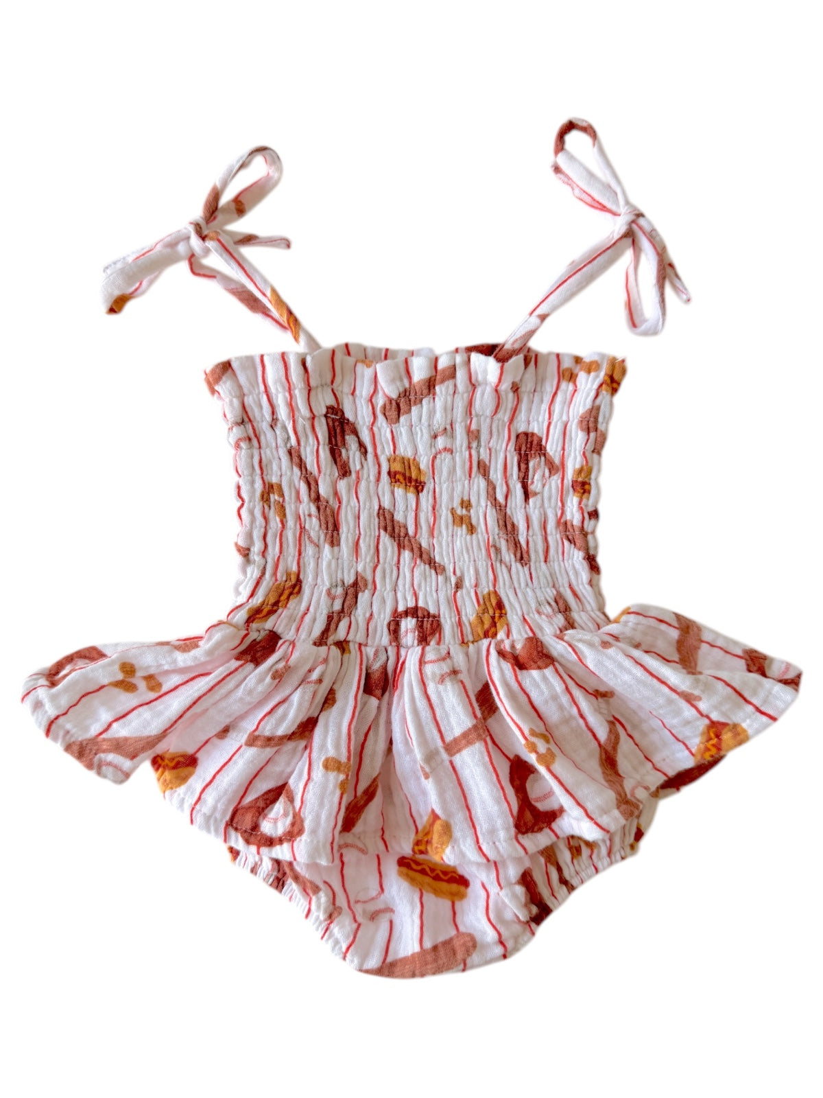 Smocked toddler swimsuit with spaghetti straps and playful food print design. Ideal for summer fun.