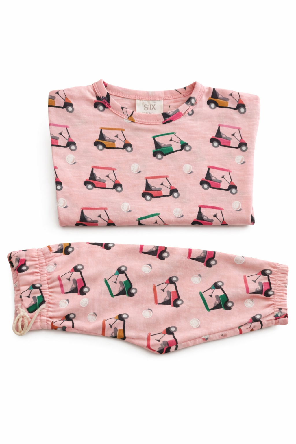 Pink golf-themed pajamas featuring golf carts and golf balls on the fabric.