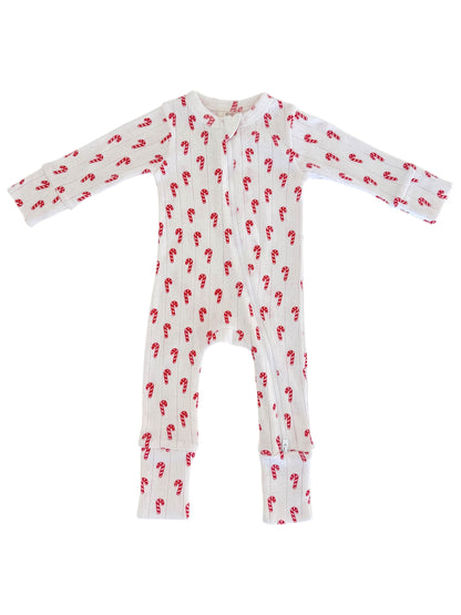 White toddler onesie with red candy cane pattern and long sleeves. Front zipper for easy dressing.