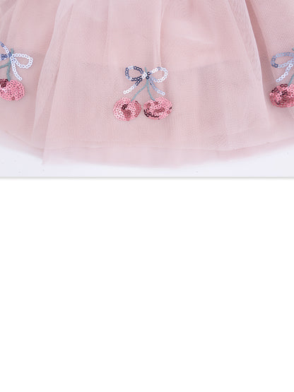 Pink tulle fabric with sequined cherry and bow embellishments. Ideal for children's clothing and dress-up outfits.