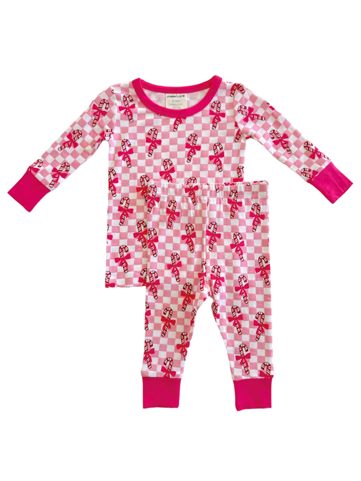 Pink and white checkered pajama set with candy cane patterns, featuring long sleeves and matching pants.