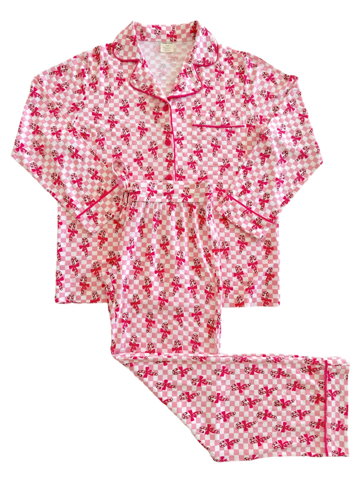 Pink checkered pajama set with a playful candy cane pattern, featuring long sleeves and pants.