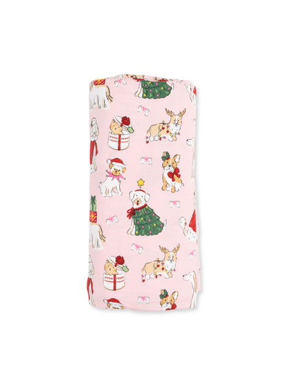 Whimsical pink fabric featuring festive dogs in holiday attire and decorations. Perfect for seasonal projects.