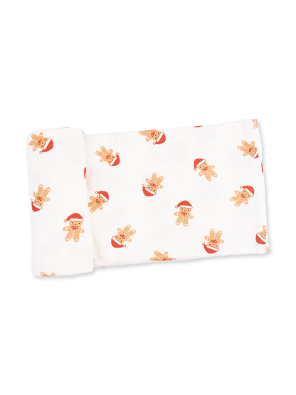 White fabric with a festive gingerbread man print wearing Santa hats. Perfect for holiday-themed projects.