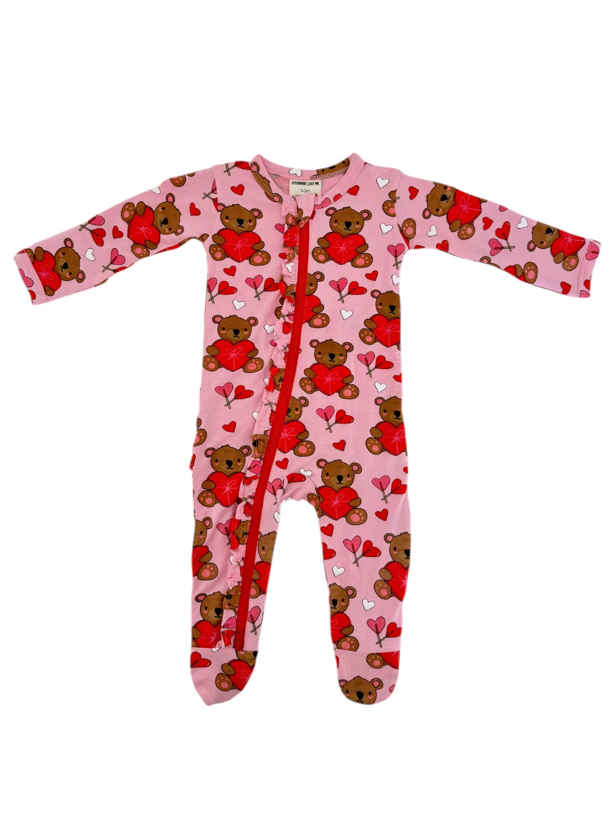 Pink children's onesie with teddy bears and hearts pattern, featuring a front zipper and long sleeves.