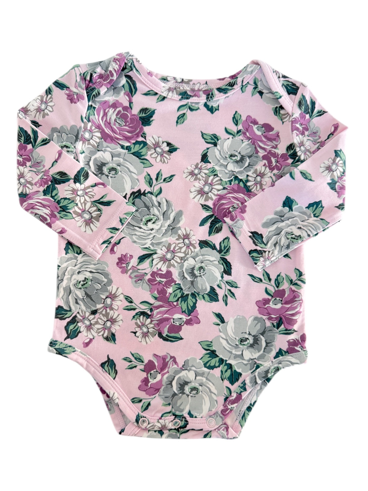 Pink floral long-sleeve baby bodysuit with purple and gray roses and green leaves on a creamy background.