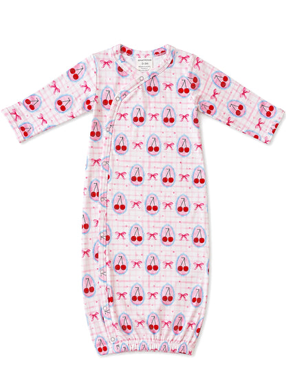 Pink baby gown with cherry and bow patterns, designed for infants 0-3 months, featuring a snap closure.