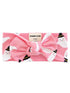 Pink baby headband with ghost patterns and a large bow, designed for infants 0-6 months.