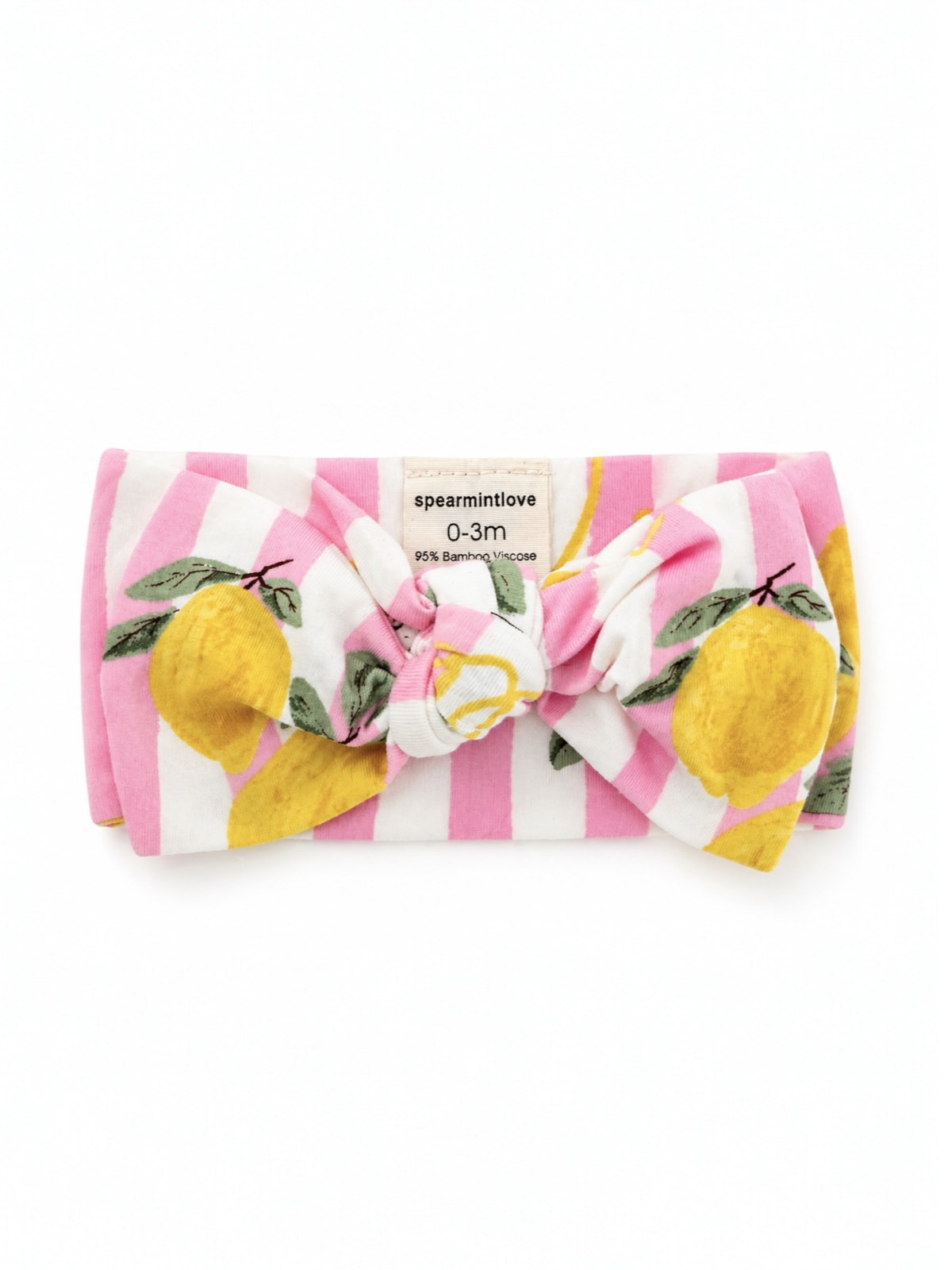 Pink striped baby headband with lemon print, featuring a large bow, labeled "spear mint love." For ages 0-3 months.