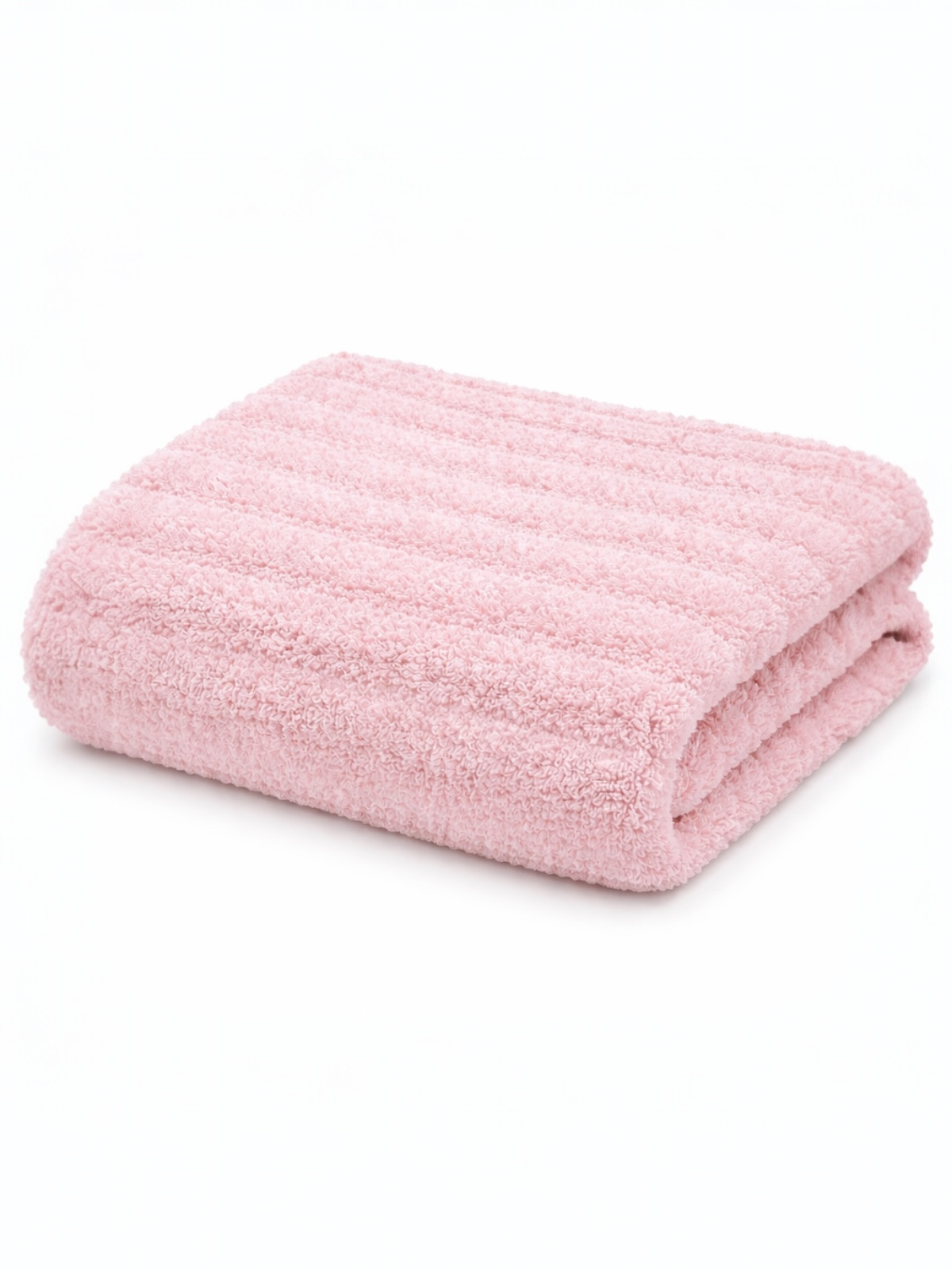 Soft pink bath towel neatly folded, featuring a textured design on a white background.