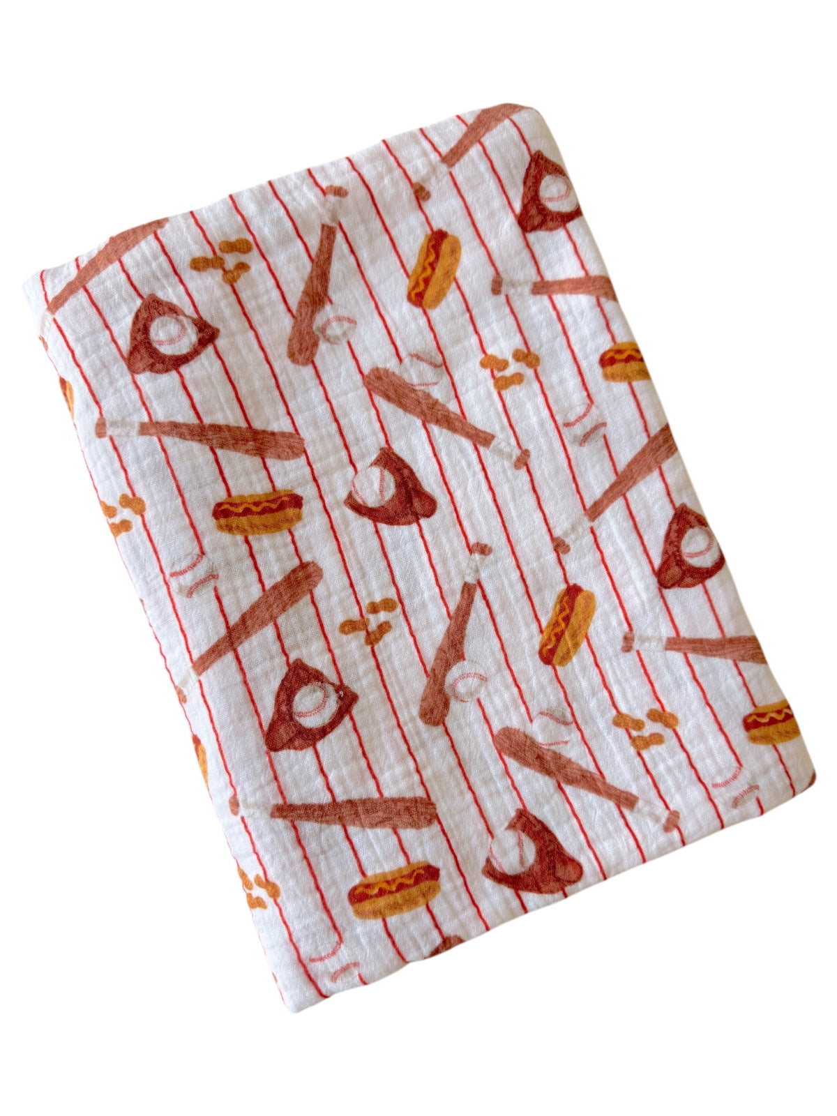 A folded towel with a playful pattern of baseballs, bats, hot dogs, and peanuts on a white background.