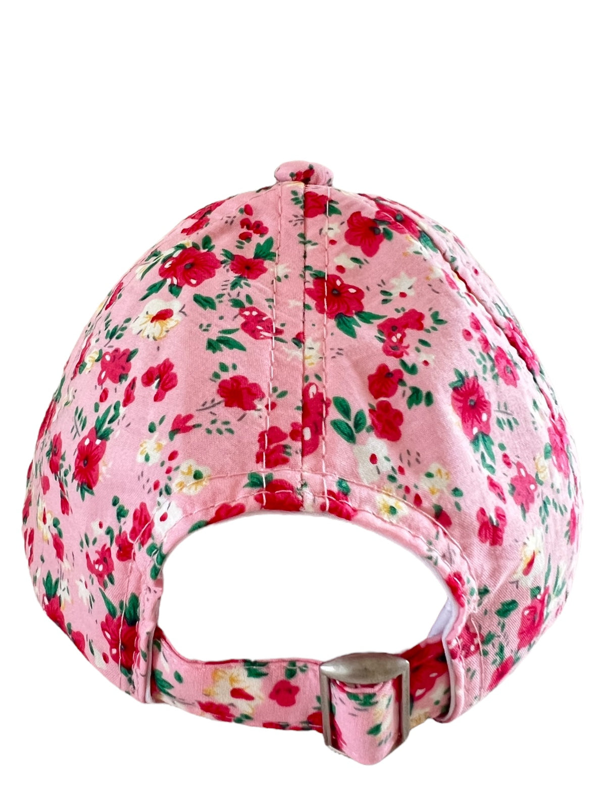Floral-patterned pink cap viewed from the back, showcasing adjustable strap and vibrant rose designs.