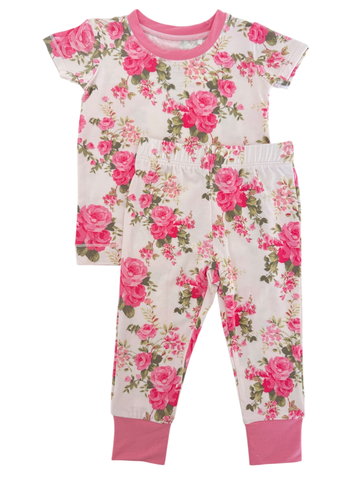 Floral baby pajama set featuring pink roses on a white background with a short-sleeve top and matching pants.
