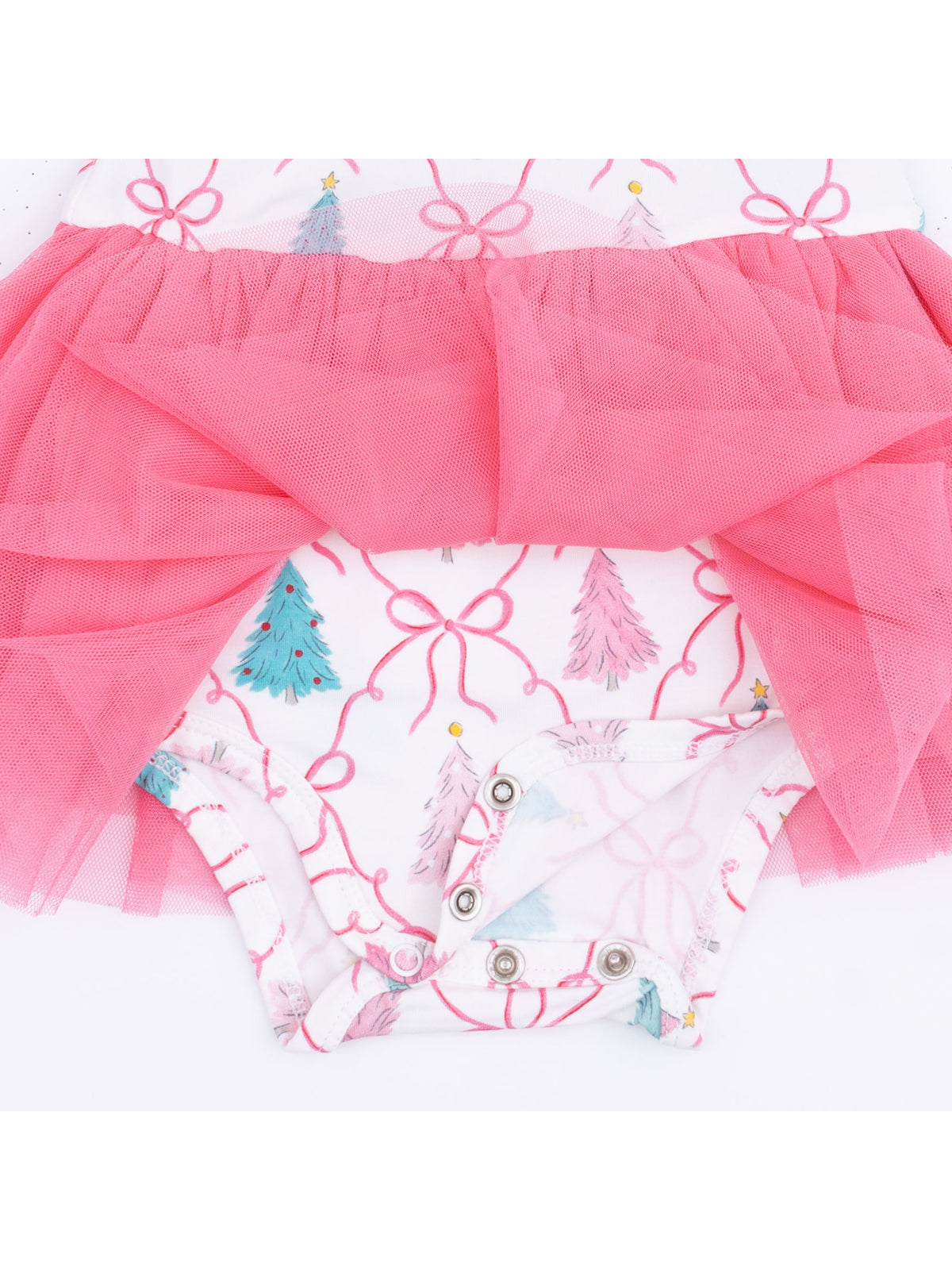 Infant onesie with pink tulle skirt, featuring decorative Christmas trees and bows on a white background.