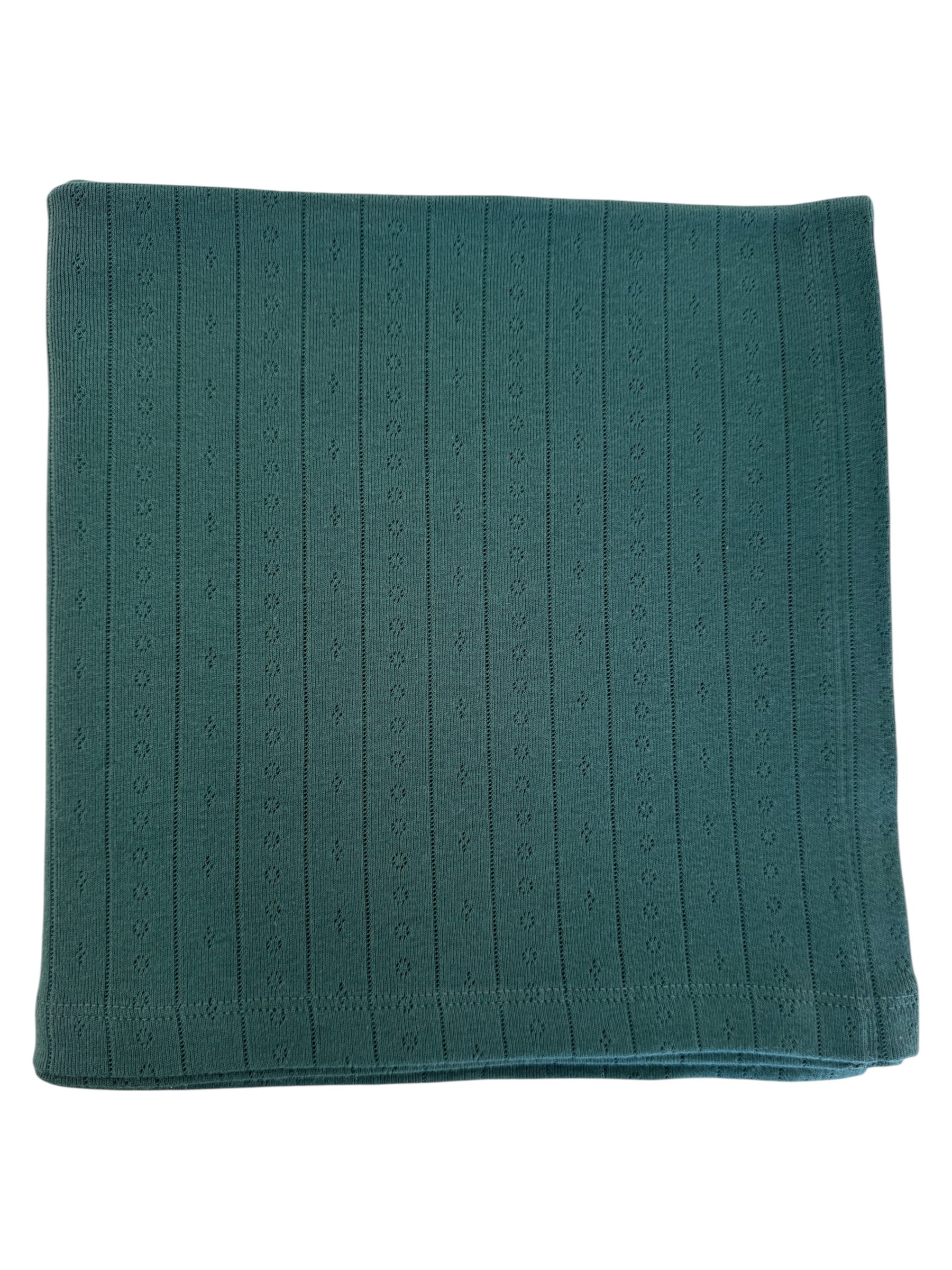 Folded green blanket with a textured, ribbed pattern. Ideal for cozying up or home decor.