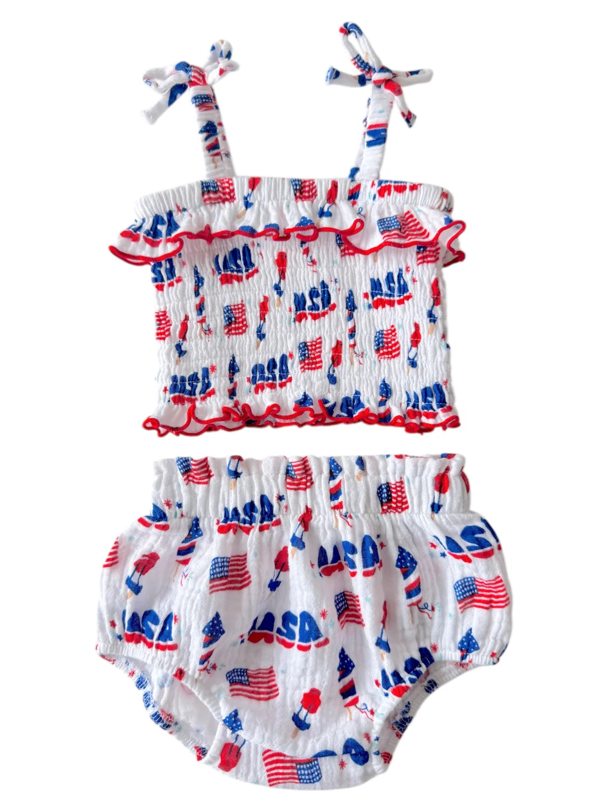 Baby girl's two-piece outfit featuring white fabric with red and blue patterns of flags and "NASA" print.