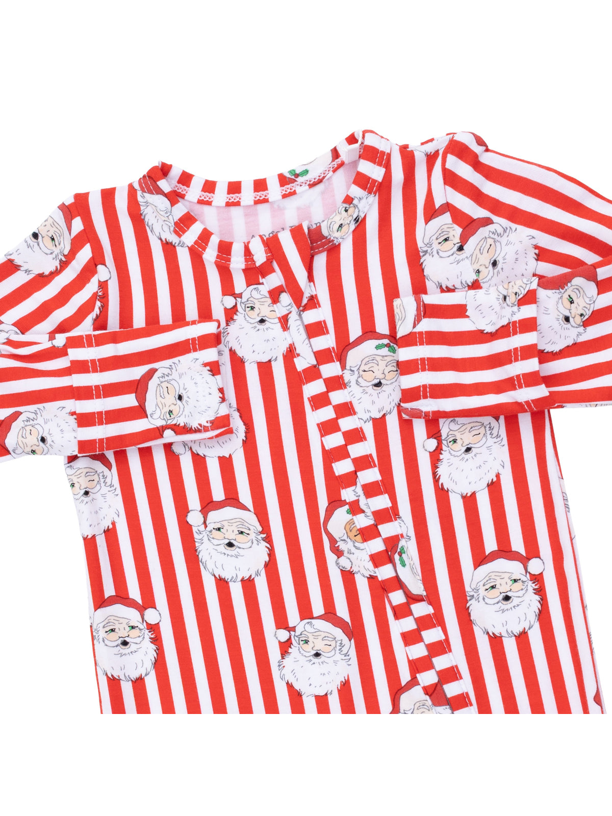 Red and white striped pajamas featuring Santa Claus faces printed throughout. Cozy holiday sleepwear for children.